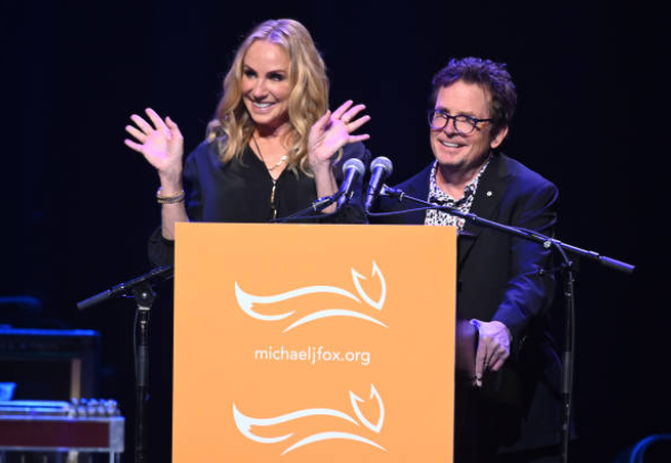Tracy Pollan (L) and Michael J. Fox speak onstage during the 2021 A Funny Thing Happened On The Way To Cure Parkinson's gal