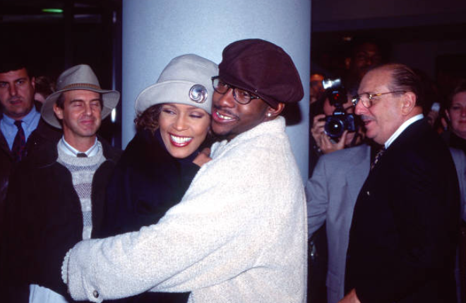Bobby Brown and Whitney Houston attend the "Cinderella" movie premiere in 1997